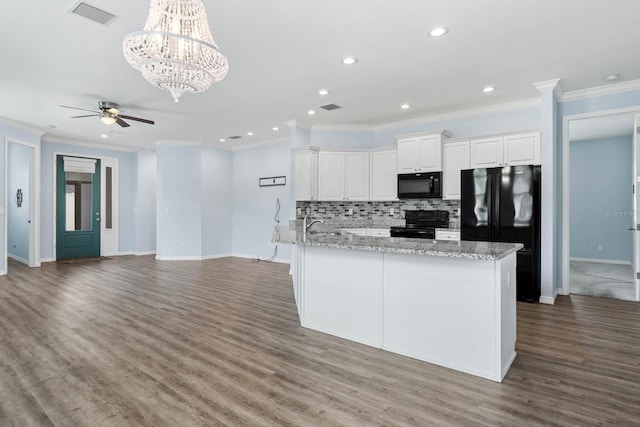 11016 Kiskadee Cir, New Port Richey, FL 34654 - kitchen featuring black appliances, recessed lighting, ceiling fan, decorative backsplash, and wood finished floors