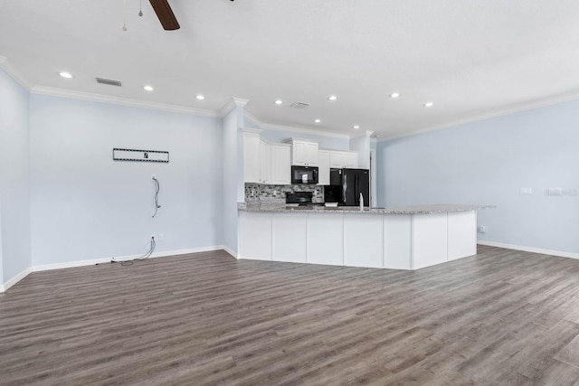 11016 Kiskadee Cir, New Port Richey, FL 34654 - unfurnished living room with ornamental molding, wood finished floors, recessed lighting, baseboards, and a ceiling fan