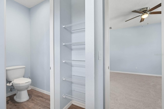 11016 Kiskadee Cir, New Port Richey, FL 34654 - bathroom featuring ceiling fan, toilet, and baseboards