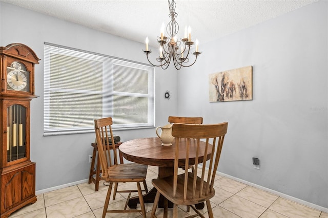 1410 Brighton Ct, Palm Harbor, FL 34684 - dining space featuring a chandelier, a textured ceiling, light tile patterned floors, and baseboards