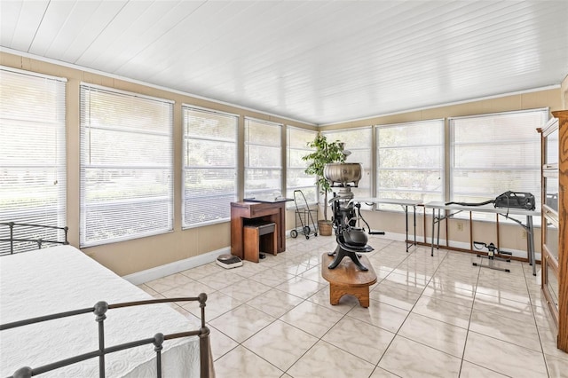 1410 Brighton Ct, Palm Harbor, FL 34684 - sunroom / solarium featuring baseboards and tile patterned flooring