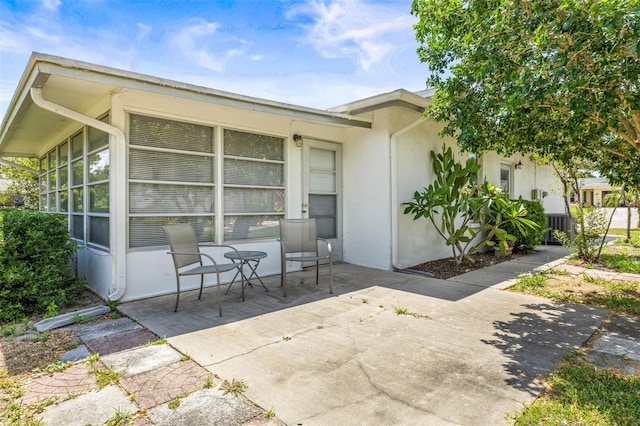 1410 Brighton Ct, Palm Harbor, FL 34684 - view of patio / terrace with a sunroom