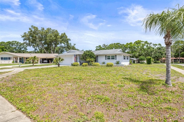 1410 Brighton Ct, Palm Harbor, FL 34684 - ranch-style house featuring concrete driveway, an attached garage, and a front lawn