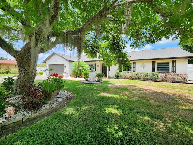 4102 Stonehenge Rd, Mulberry, FL 33860 - ranch-style home with an attached garage, a front lawn, and driveway
