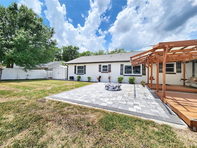 4102 Stonehenge Rd, Mulberry, FL 33860 - rear view of property featuring a pergola, a patio, a wooden deck, and brick siding