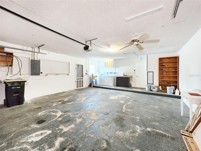 4102 Stonehenge Rd, Mulberry, FL 33860 - garage featuring washing machine and dryer, electric panel, and a garage door opener