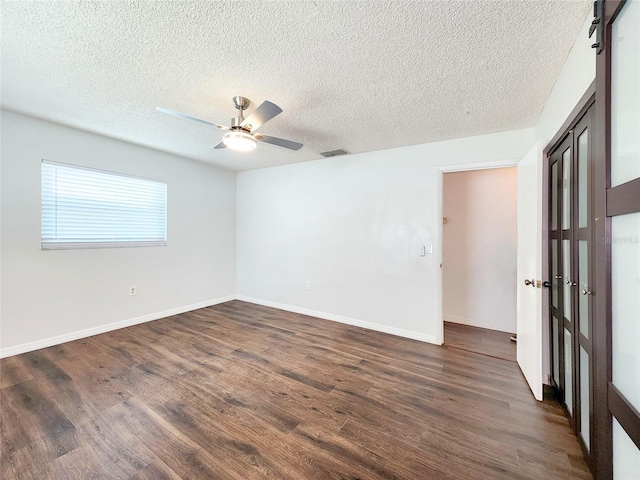 4102 Stonehenge Rd, Mulberry, FL 33860 - unfurnished room featuring dark wood finished floors, a textured ceiling, ceiling fan, and baseboards