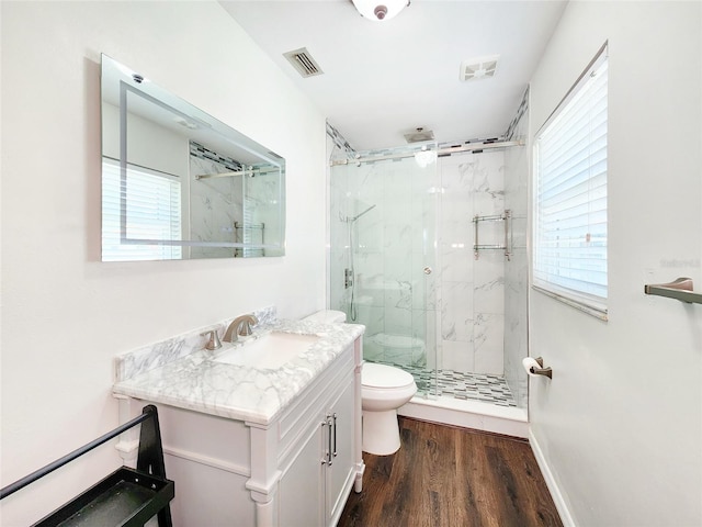 4102 Stonehenge Rd, Mulberry, FL 33860 - bathroom with toilet, a marble finish shower, plenty of natural light, and vanity