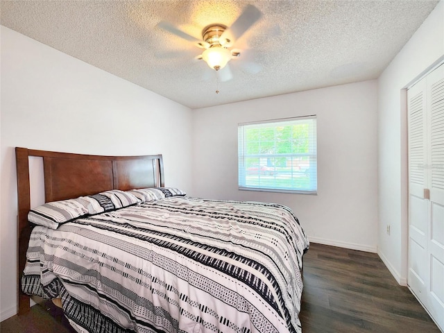 4102 Stonehenge Rd, Mulberry, FL 33860 - bedroom featuring a textured ceiling, wood finished floors, ceiling fan, baseboards, and a closet