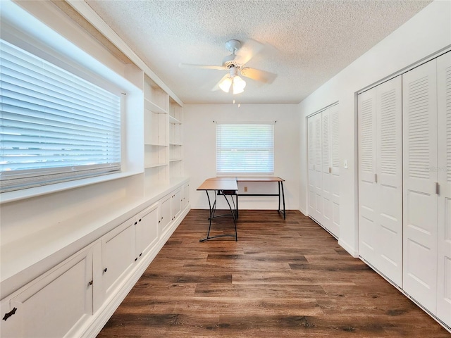 4102 Stonehenge Rd, Mulberry, FL 33860 - office space featuring a textured ceiling, a ceiling fan, and dark wood-style flooring