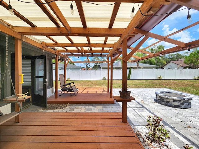 4102 Stonehenge Rd, Mulberry, FL 33860 - wooden terrace featuring a fire pit and a patio