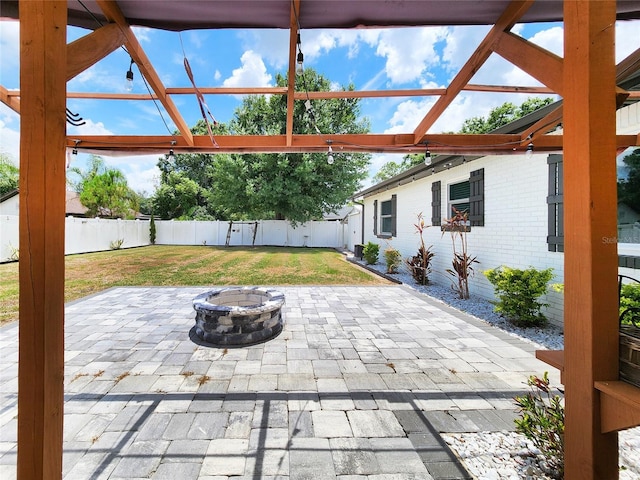 4102 Stonehenge Rd, Mulberry, FL 33860 - view of patio featuring a fire pit
