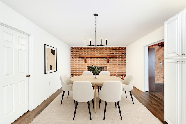 4102 Stonehenge Rd, Mulberry, FL 33860 - dining area featuring a chandelier and dark wood-style floors