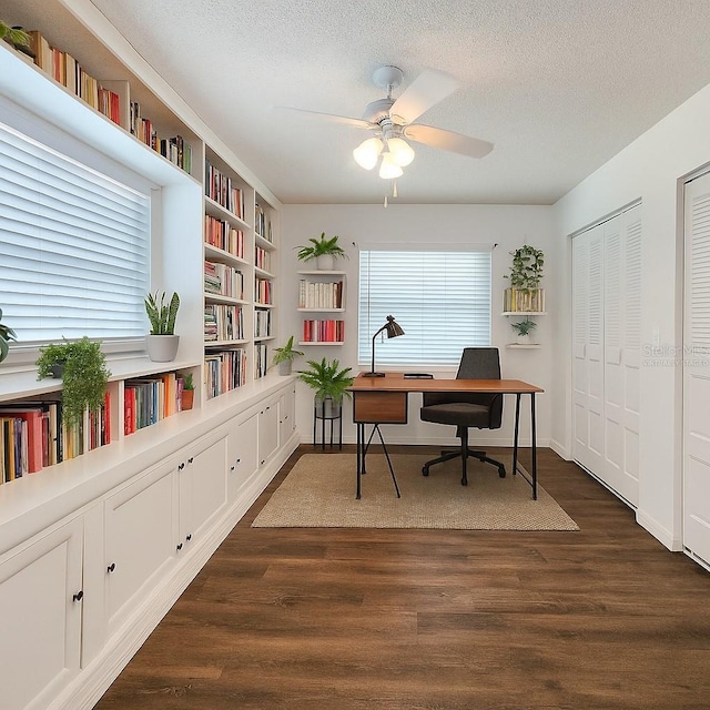 4102 Stonehenge Rd, Mulberry, FL 33860 - office with dark wood-type flooring, ceiling fan, a textured ceiling, and built in features