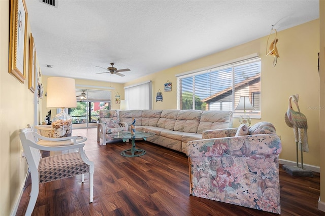 4036 Davit Dr, New Port Richey, FL 34652 - living room featuring a ceiling fan, a textured ceiling, wood finished floors, and baseboards
