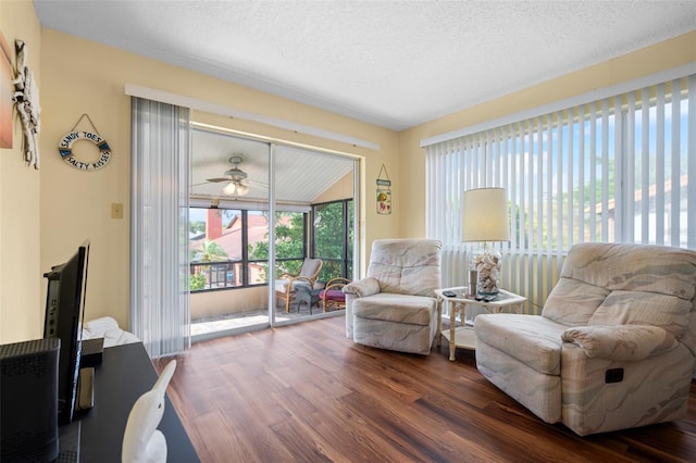 4036 Davit Dr, New Port Richey, FL 34652 - sitting room featuring wood finished floors, a ceiling fan, and a textured ceiling