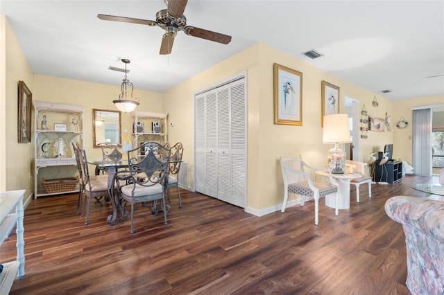 4036 Davit Dr, New Port Richey, FL 34652 - dining space with a ceiling fan, wood finished floors, and baseboards