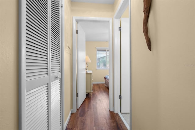 4036 Davit Dr, New Port Richey, FL 34652 - hallway featuring dark wood-style flooring and baseboards
