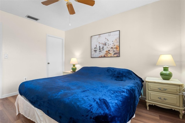 4036 Davit Dr, New Port Richey, FL 34652 - bedroom with wood finished floors, ceiling fan, and baseboards