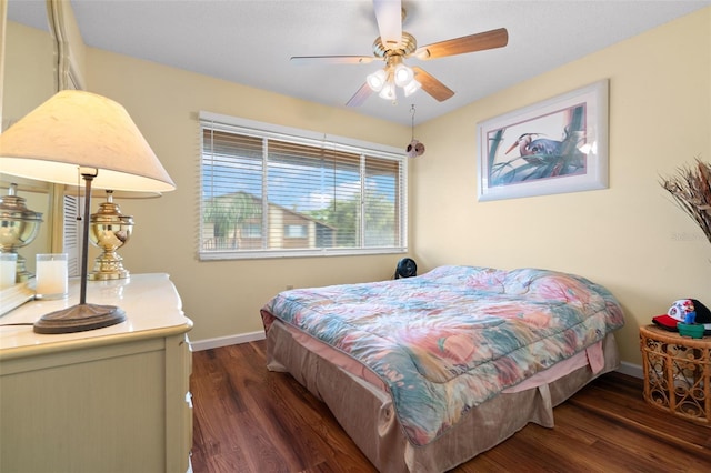 4036 Davit Dr, New Port Richey, FL 34652 - bedroom with baseboards, wood finished floors, and a ceiling fan