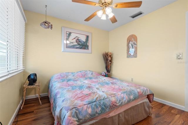 4036 Davit Dr, New Port Richey, FL 34652 - bedroom featuring wood finished floors, baseboards, and ceiling fan