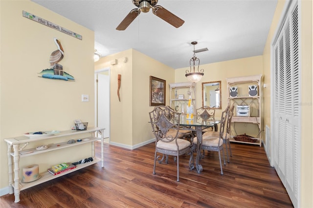 4036 Davit Dr, New Port Richey, FL 34652 - dining space with a ceiling fan, wood finished floors, and baseboards