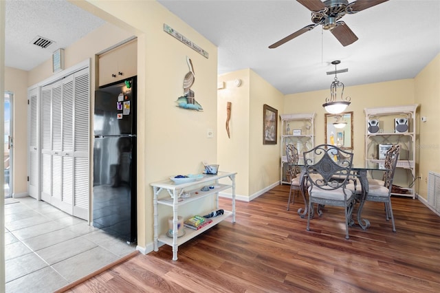 4036 Davit Dr, New Port Richey, FL 34652 - dining room with ceiling fan, wood finished floors, and baseboards