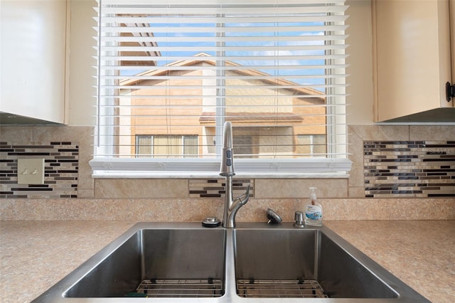 4036 Davit Dr, New Port Richey, FL 34652 - kitchen view of a sink, backsplash, and light countertops