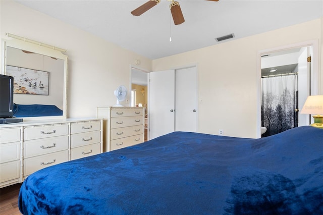 4036 Davit Dr, New Port Richey, FL 34652 - bedroom with wood finished floors, a ceiling fan, and connected bathroom