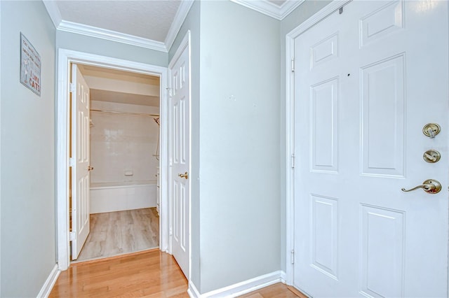 800 S Dakota Ave Unit 429, Tampa, FL 33606 - hall with light wood-style flooring, ornamental molding, and baseboards