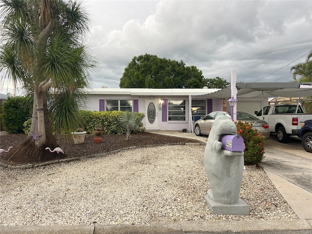 405 Bryn Mawr Is, Bradenton, FL 34207 - view of front of home with driveway, a carport, and an attached garage