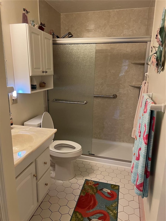 405 Bryn Mawr Is, Bradenton, FL 34207 - bathroom featuring tile patterned floors, toilet, vanity, and a shower stall