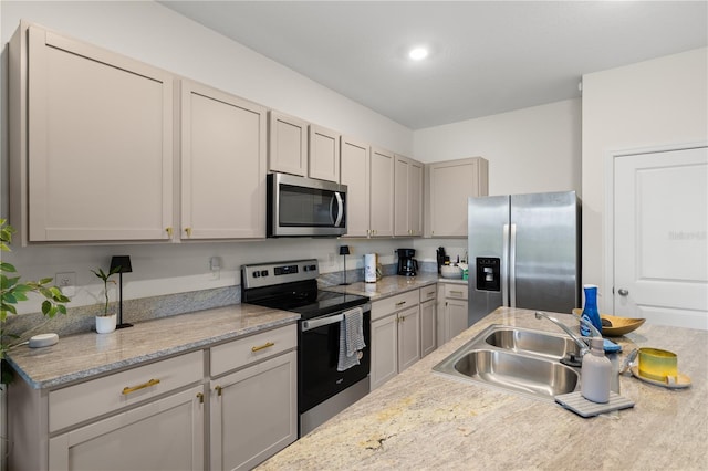 34248 Redwood Dawn Ln, Wesley Chapel, FL 33543 - kitchen featuring stainless steel appliances, a sink, light countertops, and recessed lighting