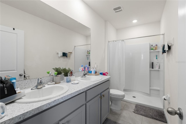 34248 Redwood Dawn Ln, Wesley Chapel, FL 33543 - bathroom featuring tile patterned floors, a shower with curtain, toilet, and double vanity