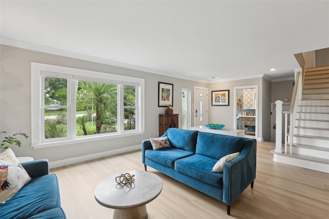 1709 Main St, Safety Harbor, FL 34695 - living room with light wood finished floors, crown molding, stairway, recessed lighting, and baseboards