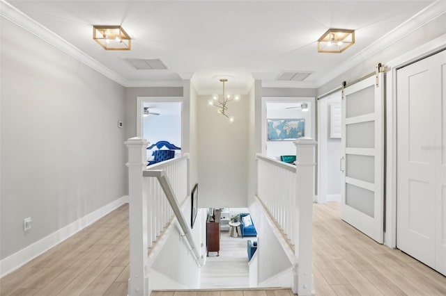 1709 Main St, Safety Harbor, FL 34695 - hallway with an upstairs landing, light wood-type flooring, crown molding, and healthy amount of natural light