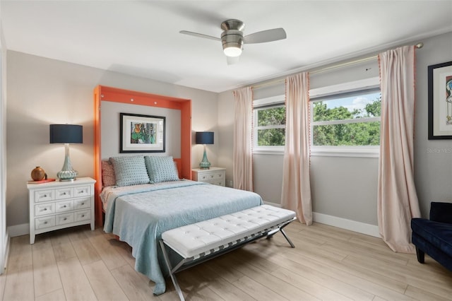1709 Main St, Safety Harbor, FL 34695 - bedroom with light wood-type flooring, baseboards, and a ceiling fan