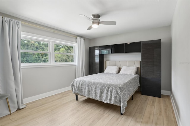 1709 Main St, Safety Harbor, FL 34695 - bedroom featuring baseboards, light wood finished floors, and ceiling fan