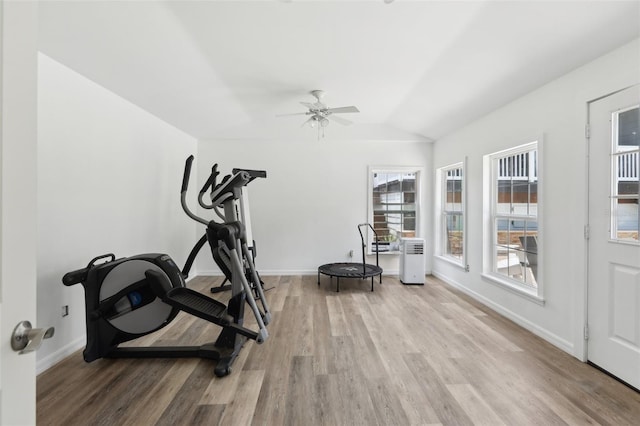 1709 Main St, Safety Harbor, FL 34695 - exercise area with light wood-style flooring, lofted ceiling, a ceiling fan, and baseboards