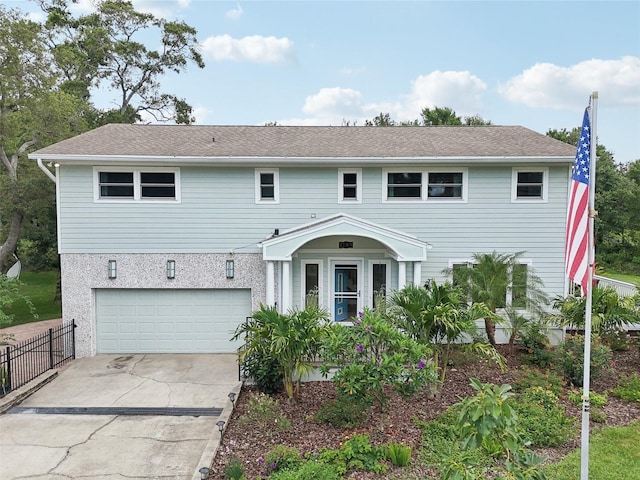 1709 Main St, Safety Harbor, FL 34695 - view of front of house with an attached garage and concrete driveway
