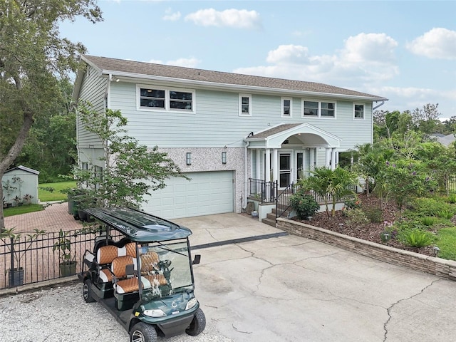 1709 Main St, Safety Harbor, FL 34695 - view of front facade featuring a garage and driveway