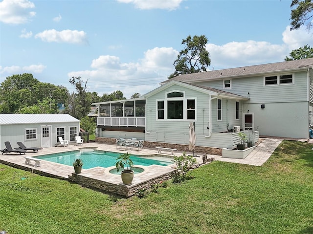 1709 Main St, Safety Harbor, FL 34695 - rear view of property with a sunroom, a patio, a yard, and an outdoor pool