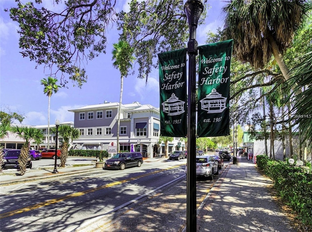 1709 Main St, Safety Harbor, FL 34695 - view of asphalt street with sidewalks, curbs, and street lights
