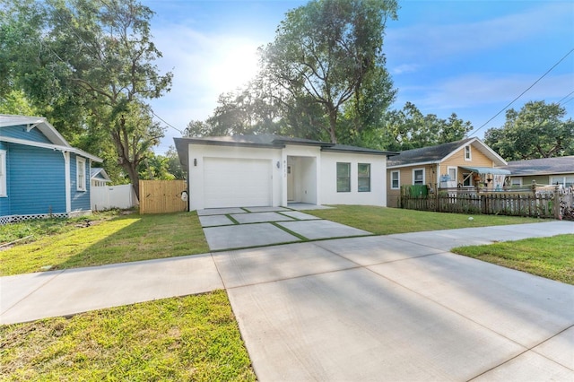8112 N 10th St, Tampa, FL 33604 - view of front of property with driveway, an attached garage, and stucco siding