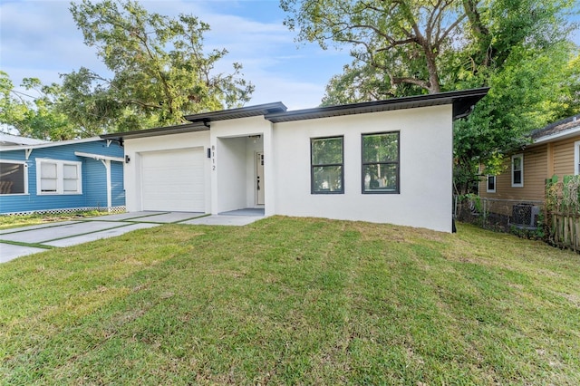 8112 N 10th St, Tampa, FL 33604 - view of front of house featuring stucco siding, an attached garage, driveway, and central air condition unit