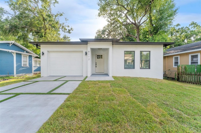 8112 N 10th St, Tampa, FL 33604 - view of front of property featuring stucco siding, driveway, and a garage