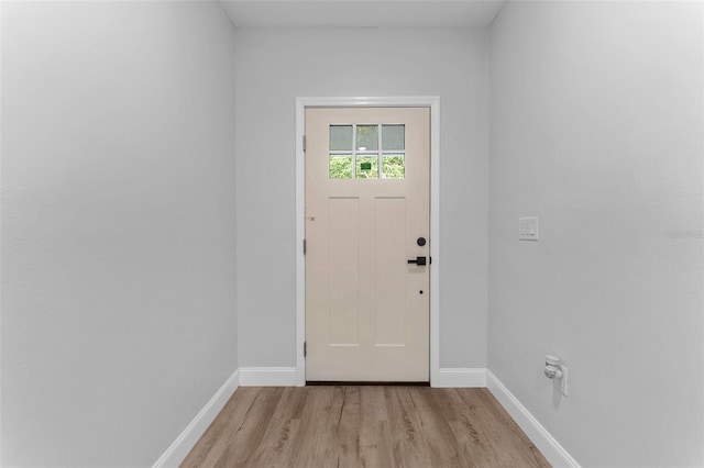 8112 N 10th St, Tampa, FL 33604 - foyer with light wood-type flooring and baseboards