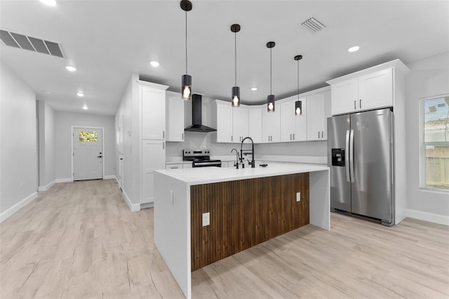 8112 N 10th St, Tampa, FL 33604 - kitchen with stainless steel appliances, wall chimney range hood, light wood-style floors, baseboards, and recessed lighting