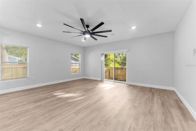 8112 N 10th St, Tampa, FL 33604 - empty room with light wood-type flooring, a ceiling fan, recessed lighting, and baseboards