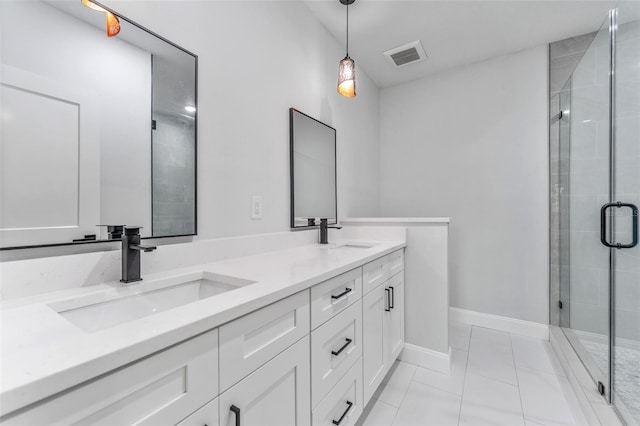 8112 N 10th St, Tampa, FL 33604 - bathroom with double vanity, a stall shower, tile patterned flooring, and baseboards